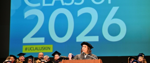 Caroline Menjivar speaks on stage at UCLA Luskin Commencement ceremonies on June 12, 2026. She is a California State Senator and a prominent alumna of the UCLA Luskin School of Public Affairs, having earned her Master of Social Welfare (MSW) in 2018.