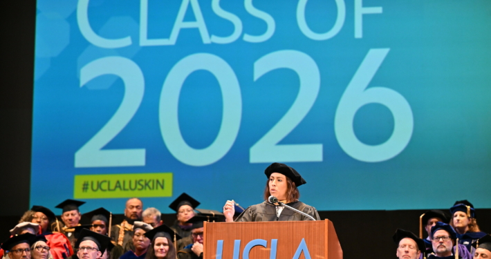 Caroline Menjivar speaks on stage at UCLA Luskin Commencement ceremonies on June 12, 2026. She is a California State Senator and a prominent alumna of the UCLA Luskin School of Public Affairs, having earned her Master of Social Welfare (MSW) in 2018.