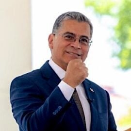 Xavier Becerra in a blue suit