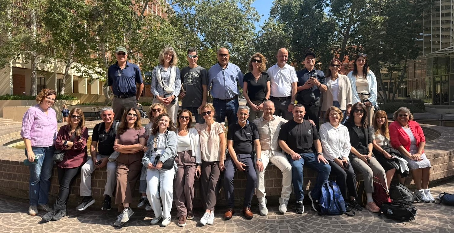 Large group of people pose outdoors