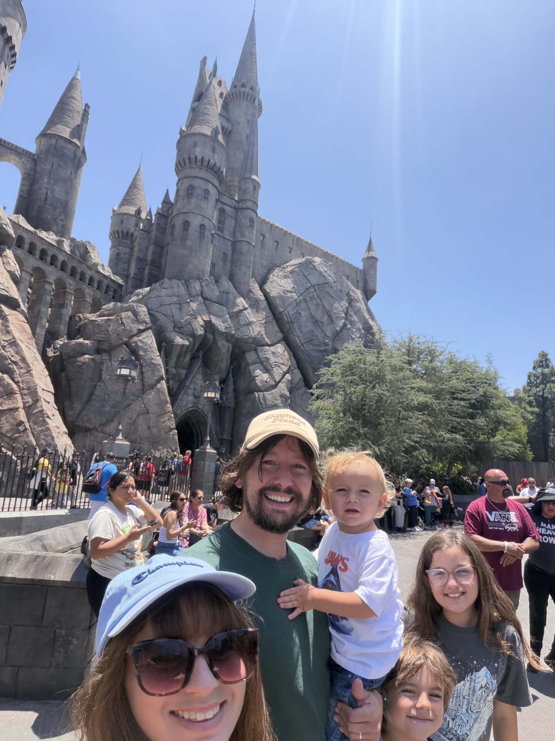 Emily Dillon with her three children and husband at an amusement park