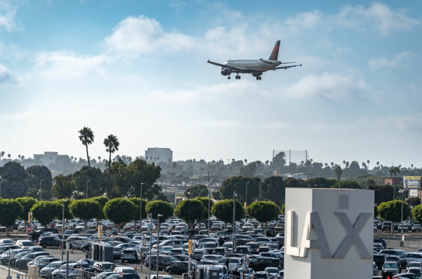 LAX airport with airplane about to land at the airport.