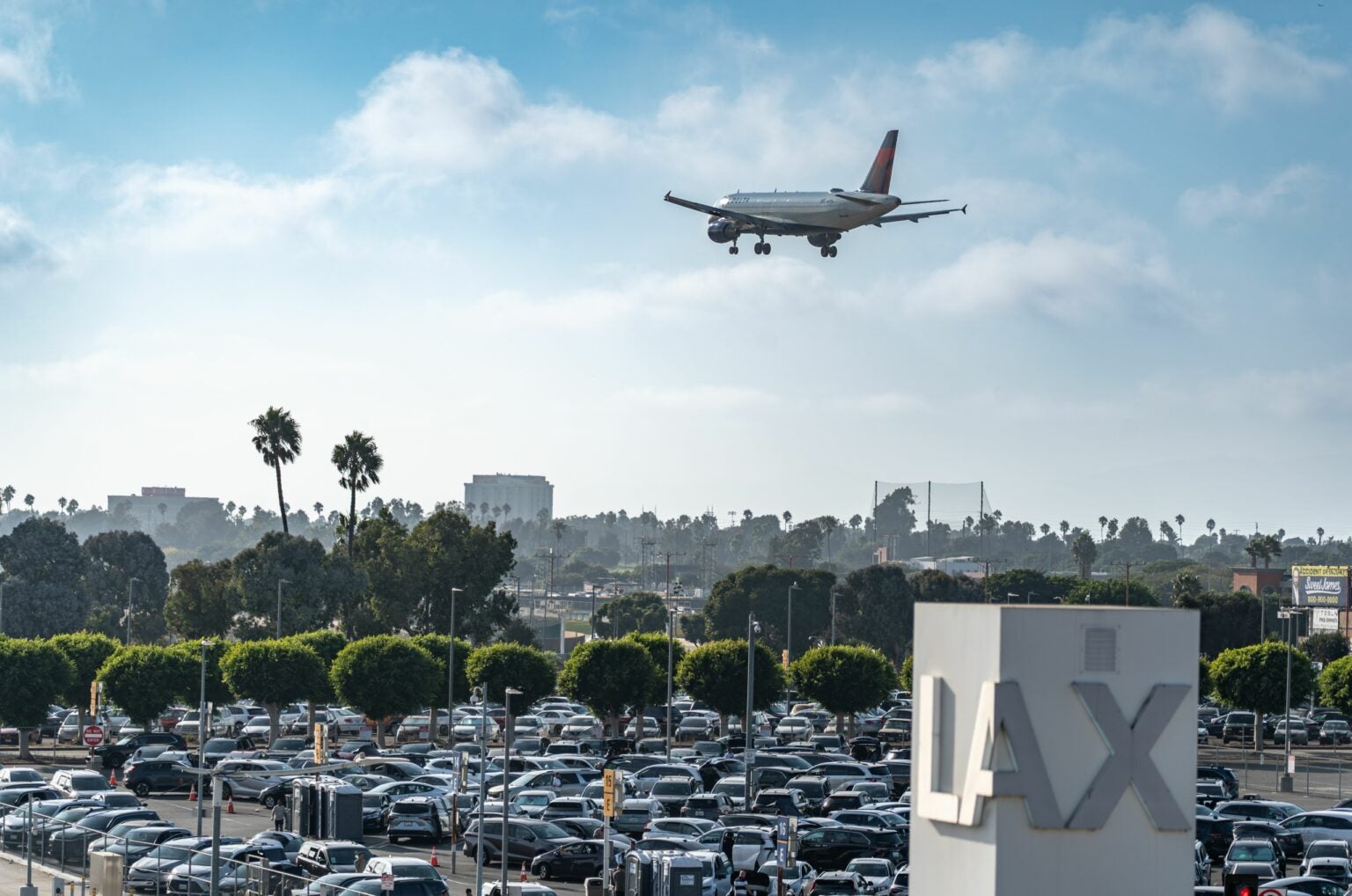 LAX airport with airplane about to land at the airport.