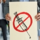 Protester holds anti-vaccine poster