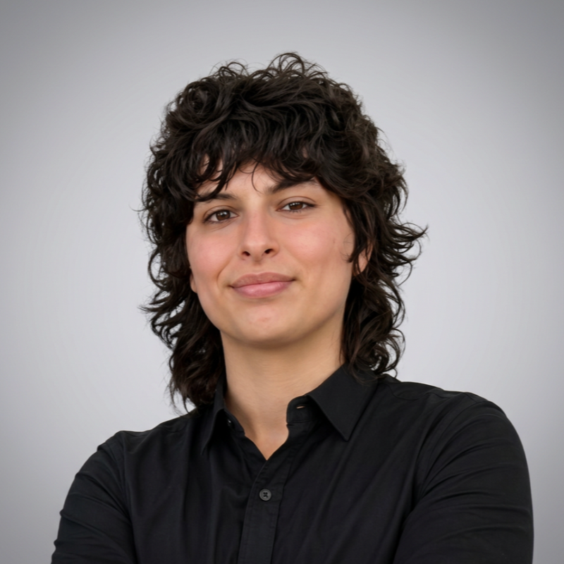 person with dark hair in black shirt