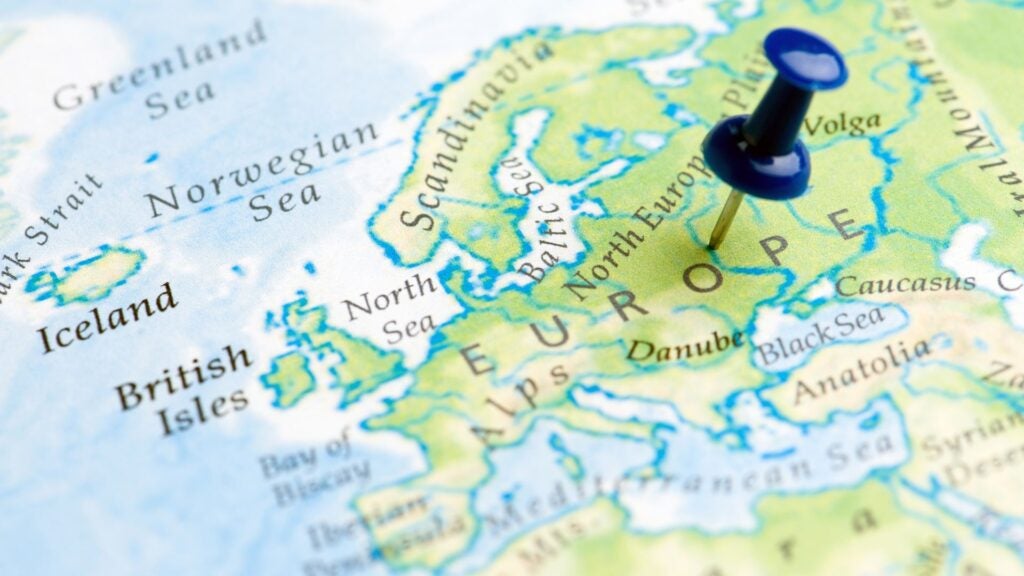Close up of map of European countries with a pin in the word "Europe"