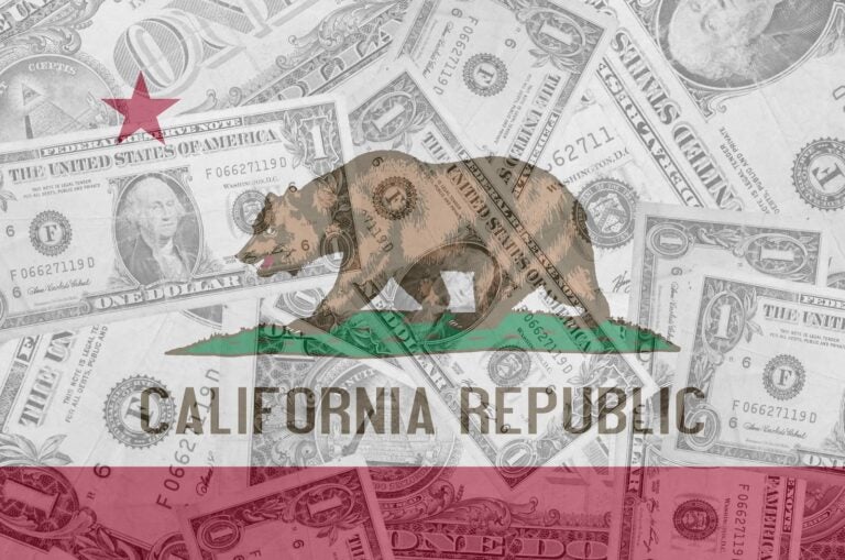 California flag with bear and star, overlaid against dollar bills