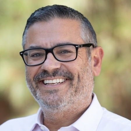 Headshot of Matt Bareto man with glasses and beard