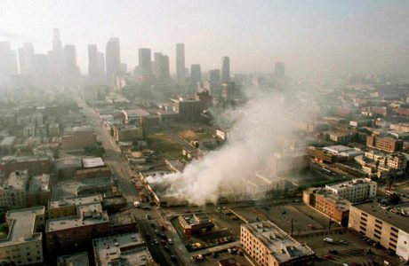 Aerial image of smoke rising from a shopping center in downtown Los Angeles during the 1992 race riots.