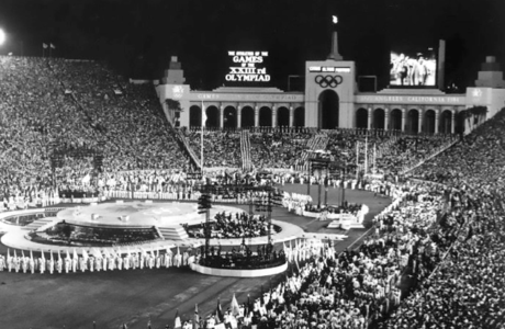 historic black and white picture of L.A. Coliseum during Olympic ceremony