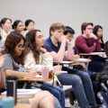 Public policy students in class listening to a lecture