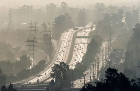 sepia tone shot of freeway shrouded in smog