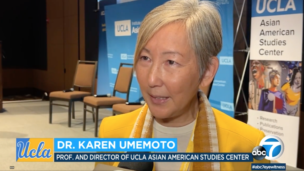 woman speaking to news crew|