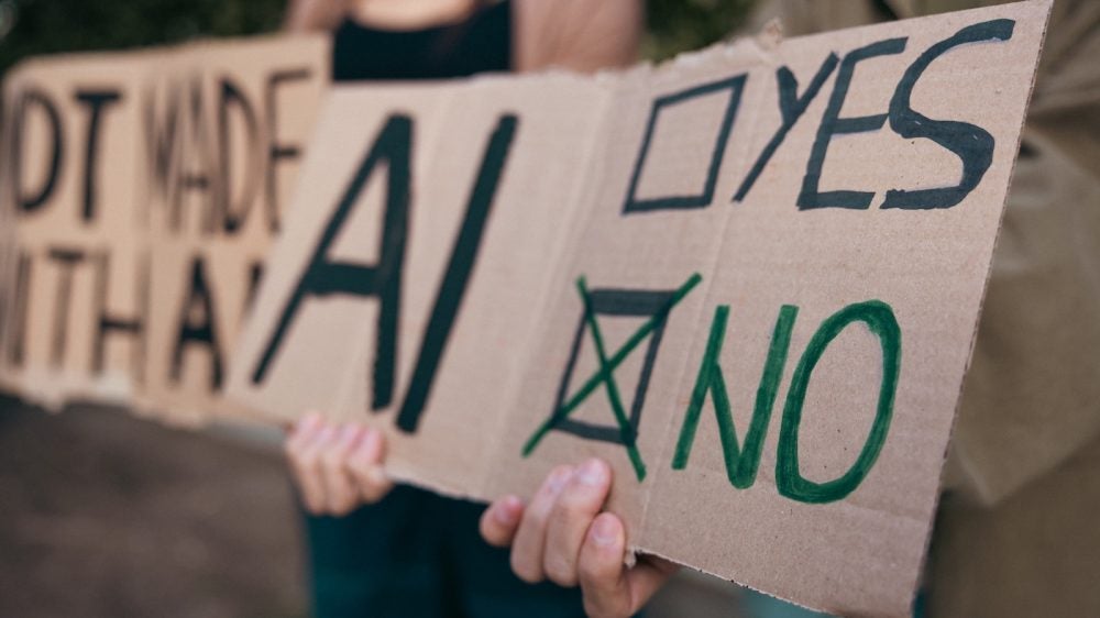 protest signs in opposition to artificial intelligence