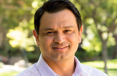 outdoor portrait of man in light-colored shirt