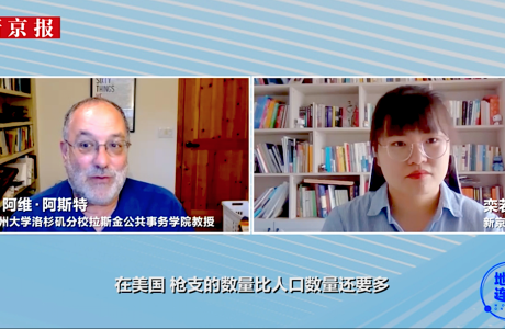 Video screenshot of news interview with man on left, woman on right