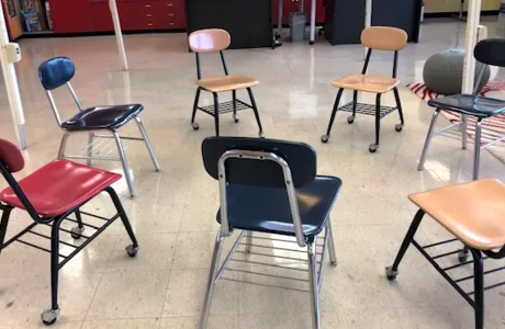 Child-size school chairs in circle
