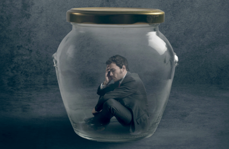 illlustration with man in suit inside glass jar