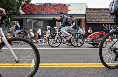 several people on bicycles on streets with bike lanes