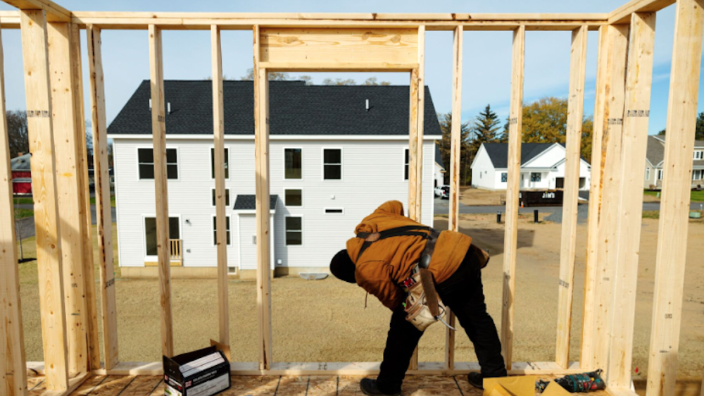 worker building home in back yard