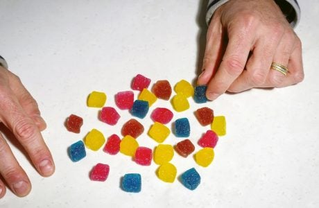 multi-colored chewables on a white surface