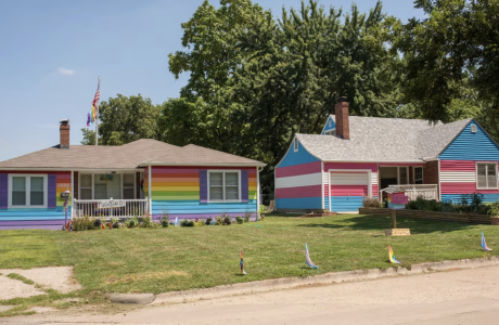Two houses painted in rainbow colors