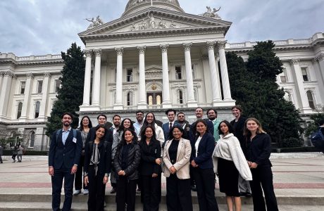 Group of people in front of ornate white building||Public Policy student Andrea Escobar's headshot