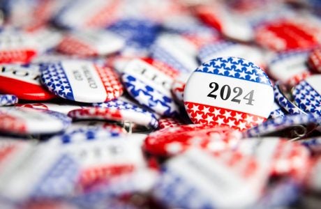 red, white and blue election buttons emblazoned with "2024"