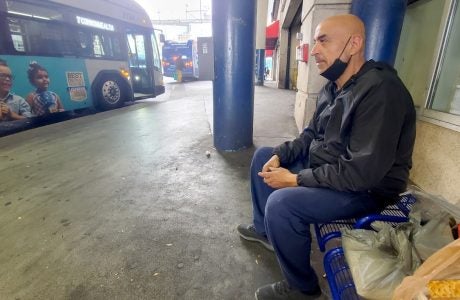 Man waiting at bus stop