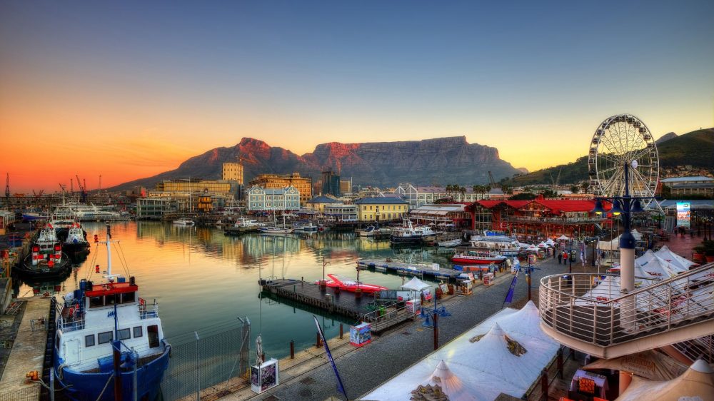 Photo of Port in South Africa with boats on the harbor and a ferris wheel far away on the right