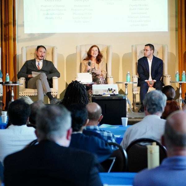 5 panelists sit on stage in the UCLA Kerckhoff Grand Salon for the 2026 Berggruen Governance Index "Four Worlds of Governance" event on May 6.||