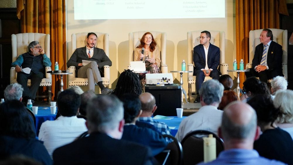 5 panelists sit on stage in the UCLA Kerckhoff Grand Salon for the 2026 Berggruen Governance Index "Four Worlds of Governance" event on May 6.||