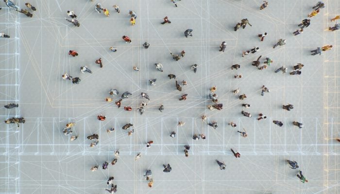 Abstract crowds of people with virtual reality street display.