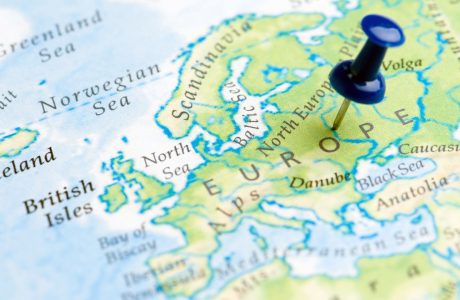 Close up of map of European countries with a pin in the word "Europe"