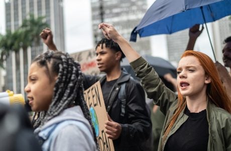 Protestors shouting during a demonstration in the street
