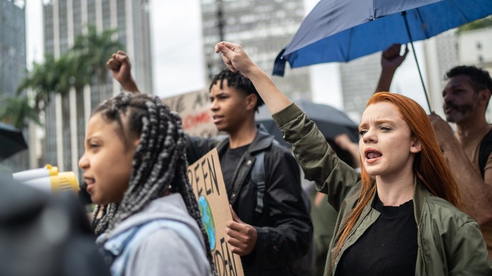 Protestors shouting during a demonstration in the street