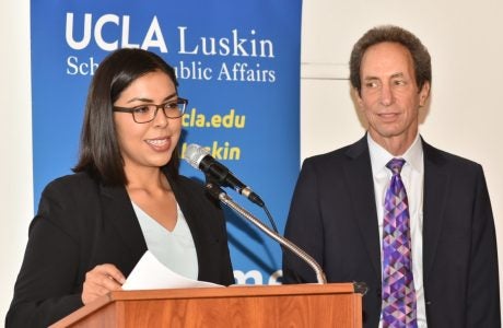 Public policy student Irma Castañeda tells about the mentorship provided by Senior Fellow Tom Epstein, right. Photo by Todd Cheney