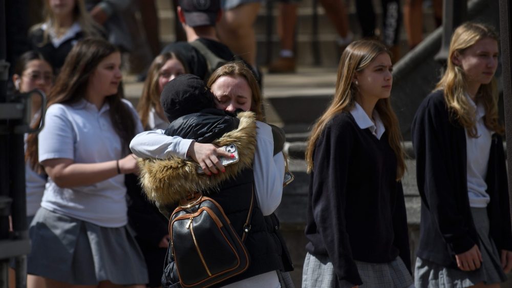 female students hug