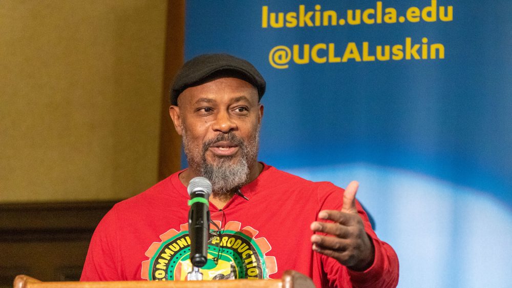 Activist Kali Akuno makes an appeal for "collaborating, dialoguing and doing deep planning with each other to deal with the needs within our communities." Photo by Les Dunseith