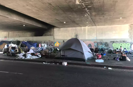 tents housing homeless in road tunnel