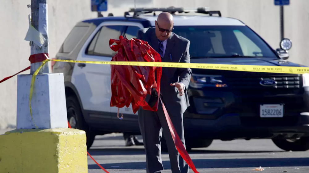 police detective at crime scene with police tape