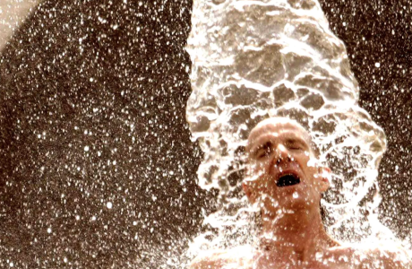 Man in splash pool, with only head visible
