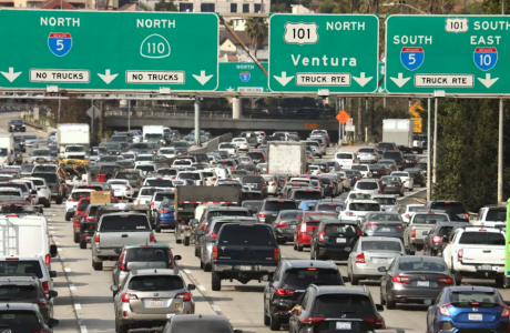 heavy traffic under freeway signs