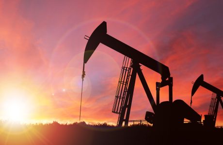 Oil well at sunset.