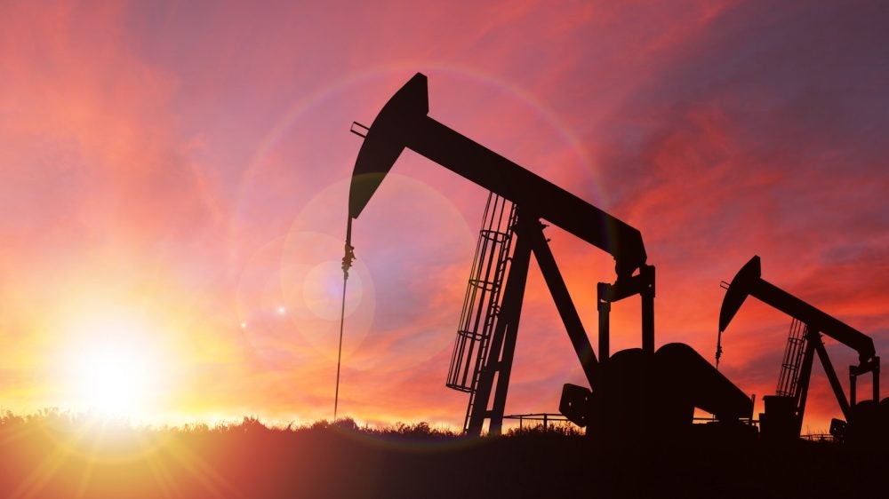 Oil well at sunset.