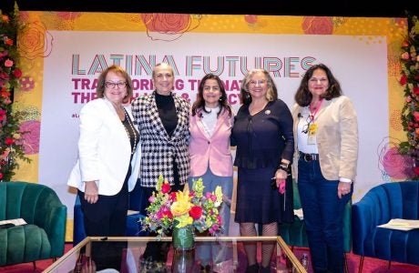 Five women standing in from of sign saying "Latina Futures"