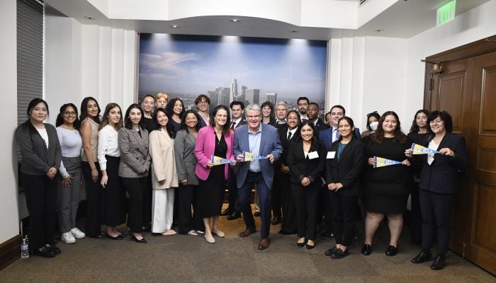 Group photo of UCLA students at Los Angeles City Hall with politicians