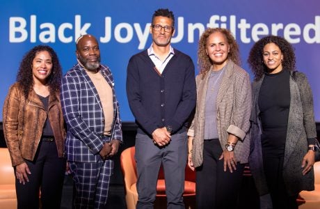 Panelists from the Luskin Lecture on February 25 at the UCLA Nimoy Theater with Michael Harriot, Michael Lens, and Safiya Noble stand on center stage to pose for a group photo.