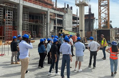 Students in blue hard hats at construction site|headshots of two men in dark suits