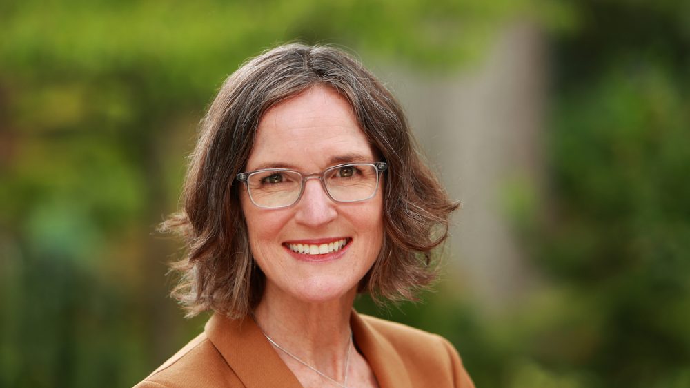woman with glasses and short brown hair